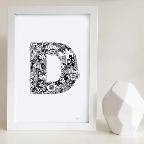 The floral letter 'D' artwork was illustrated by Hayley Lauren in Melbourne, Australia. It is the perfect artwork to personalise a nursery or kids bedroom.